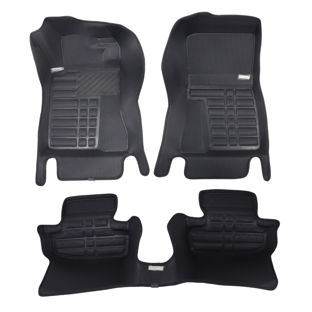 Set of black car floor mats on a white background