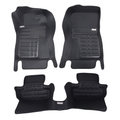 Set of black car floor mats on a white background