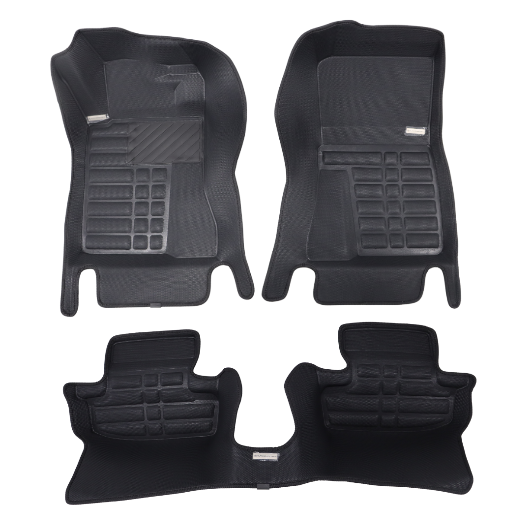 Set of black car floor mats on a white background