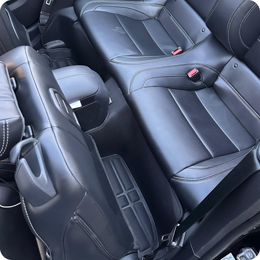 Close-up of black car seats with visible stitching
